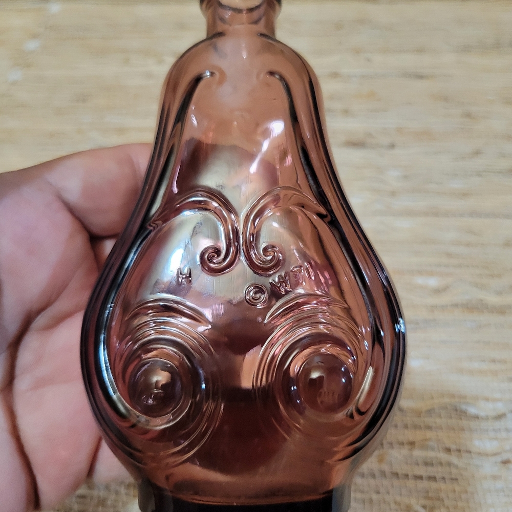 Wheaton Amethyst Pear Shaped Bottle with Raised Scroll Approx: 5"